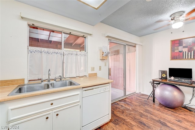 kitchen featuring hardwood / wood-style floors, white dishwasher, sink, a textured ceiling, and ceiling fan