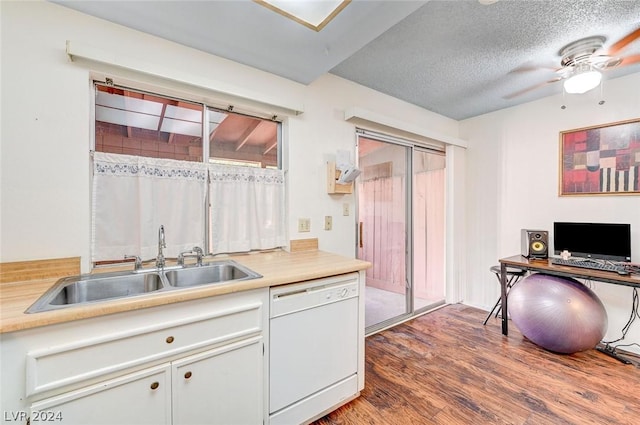 4770 Topaz St Unit 18, Las Vegas, NV 89121 - kitchen featuring wood finished floors, white dishwasher, ceiling fan, a sink, and light countertops