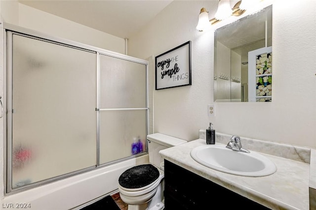 4770 Topaz St Unit 18, Las Vegas, NV 89121 - bathroom featuring vanity, toilet, and shower / bath combination with glass door