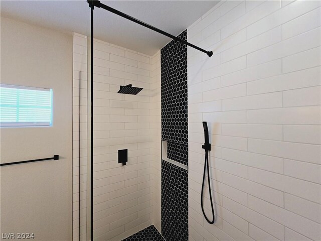 bathroom featuring a tile shower