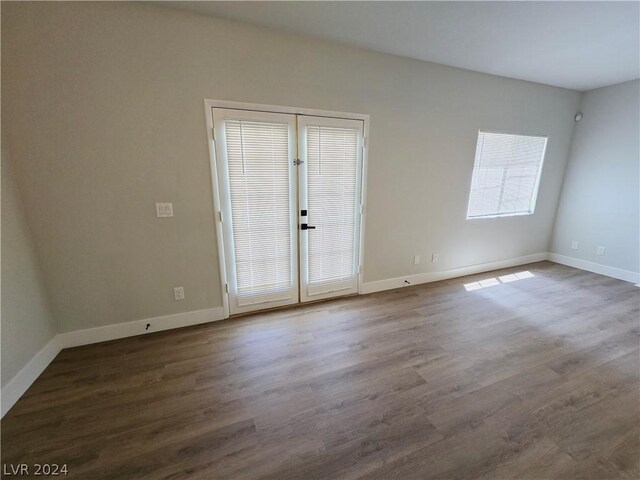 empty room with hardwood / wood-style floors