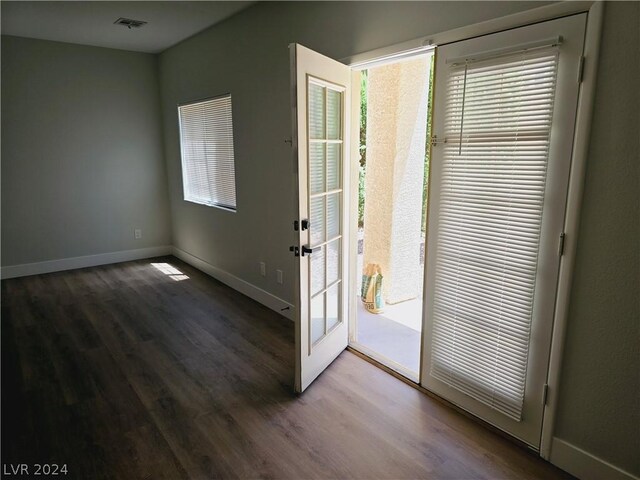 doorway with dark hardwood / wood-style flooring