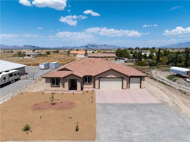 view of front of house featuring a mountain view and a garage