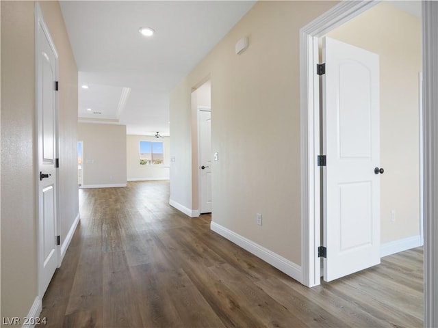 hall with hardwood / wood-style flooring