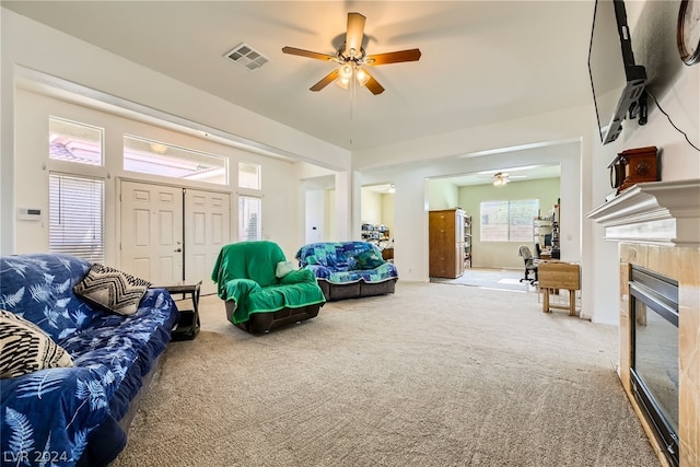 1505 Barrington Oaks St, North Las Vegas, NV 89084 - carpeted living room featuring a ceiling fan and a fireplace
