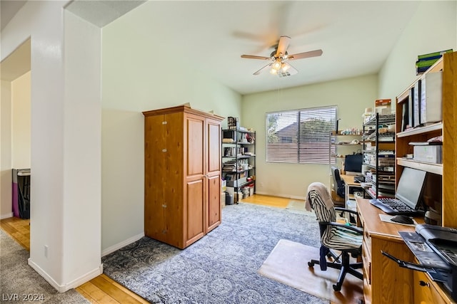 office space with ceiling fan and light hardwood / wood-style floors