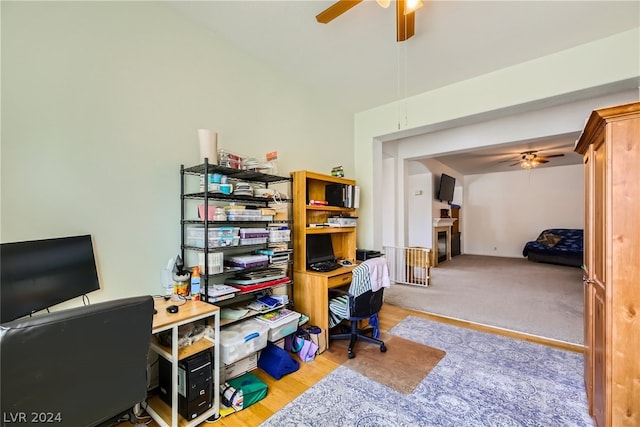 carpeted office featuring ceiling fan