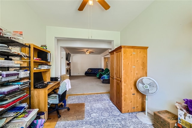 office space with light carpet and ceiling fan