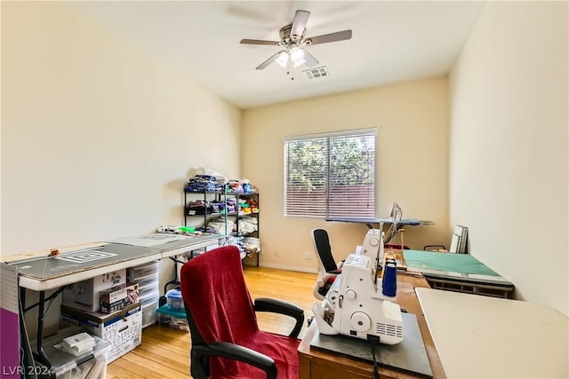 office space featuring light hardwood / wood-style floors and ceiling fan