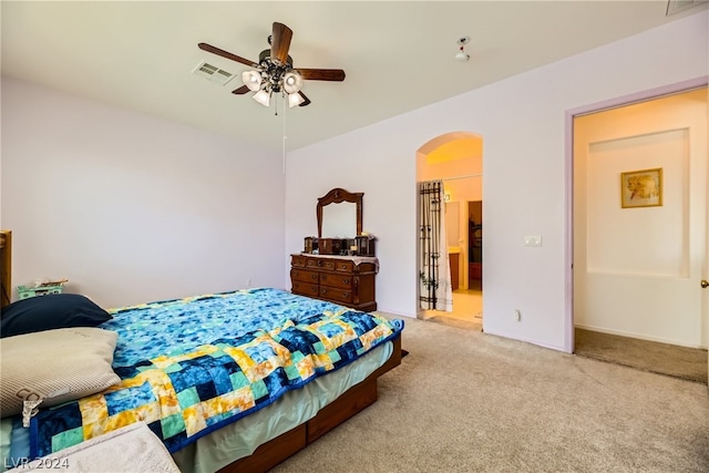 bedroom featuring light carpet and ceiling fan