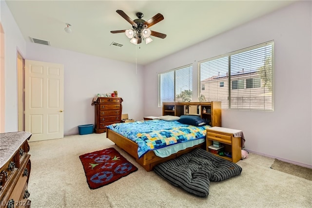 carpeted bedroom featuring ceiling fan