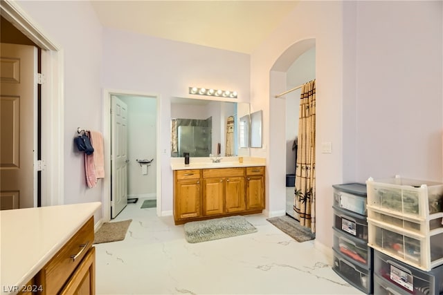 1505 Barrington Oaks St, North Las Vegas, NV 89084 - bathroom featuring marble look tile flooring, a shower with shower curtain, vanity, and baseboards