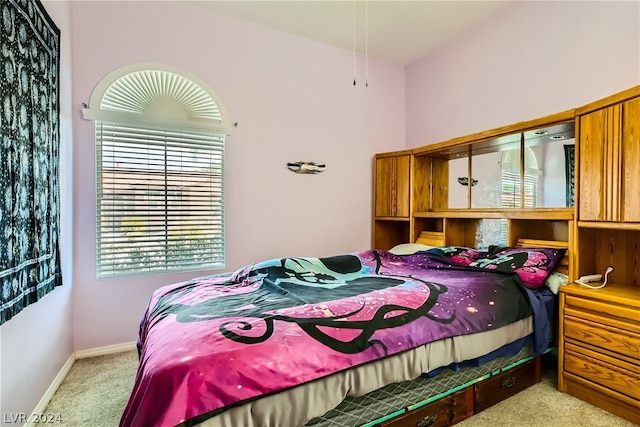 bedroom featuring light carpet