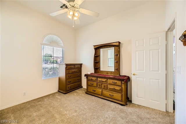 bedroom with light carpet and ceiling fan