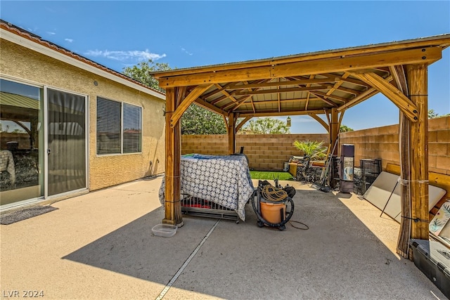 1505 Barrington Oaks St, North Las Vegas, NV 89084 - view of patio / terrace featuring a gazebo and a fenced backyard