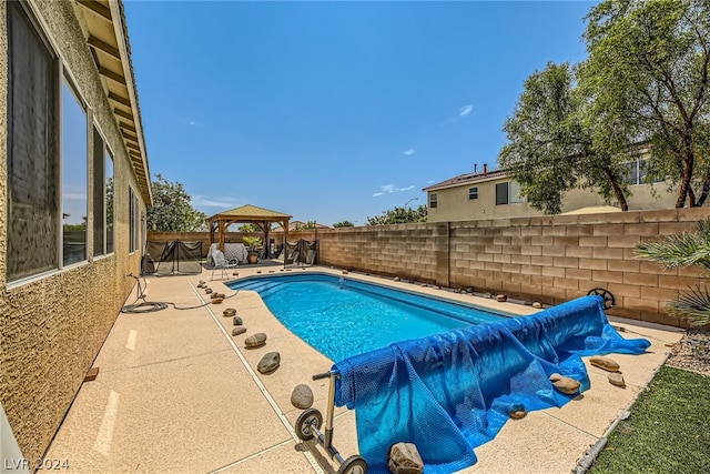 view of pool featuring a patio and a gazebo