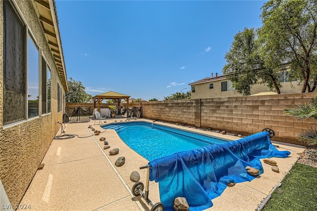 1505 Barrington Oaks St, North Las Vegas, NV 89084 - view of swimming pool with a gazebo, a patio area, and a fenced backyard