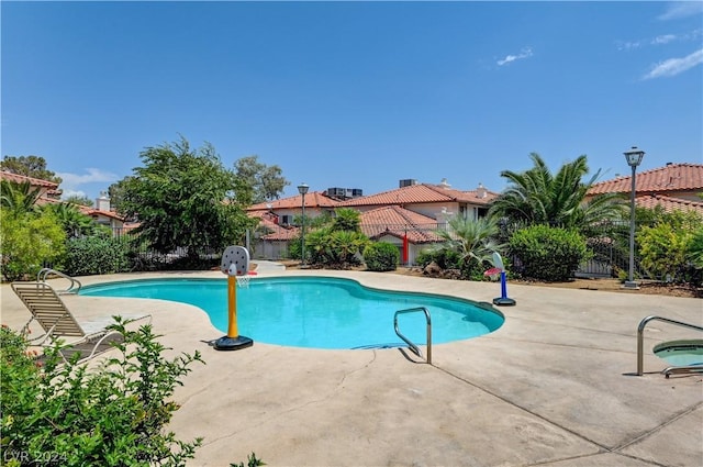 view of pool featuring a patio