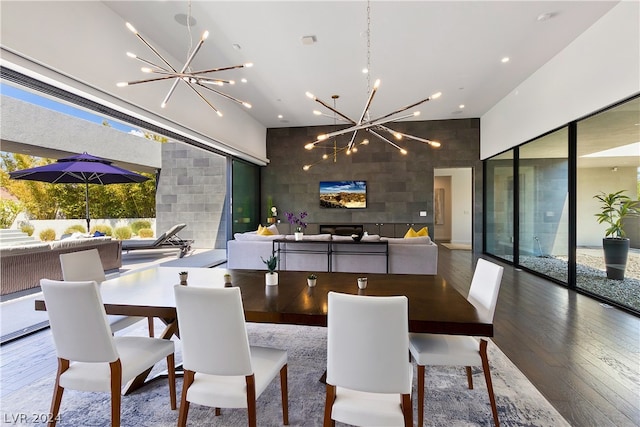 dining space featuring hardwood / wood-style floors and a chandelier