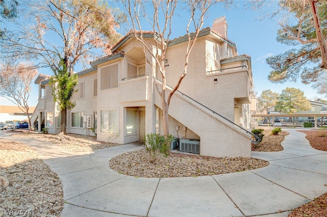 view of front of home with cooling unit