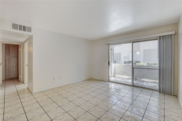 view of tiled spare room