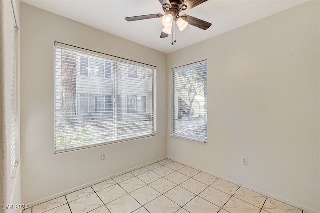 unfurnished room with ceiling fan