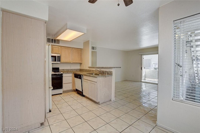 kitchen with appliances with stainless steel finishes, sink, light tile patterned floors, ceiling fan, and light brown cabinets