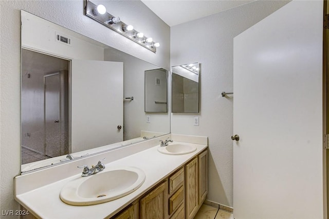 bathroom featuring vanity and tile patterned flooring