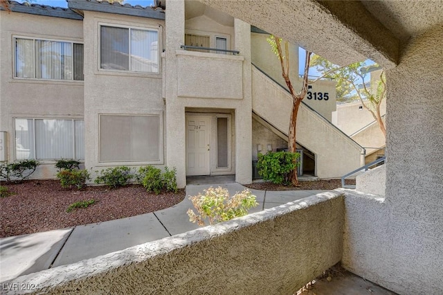 doorway to property featuring a balcony