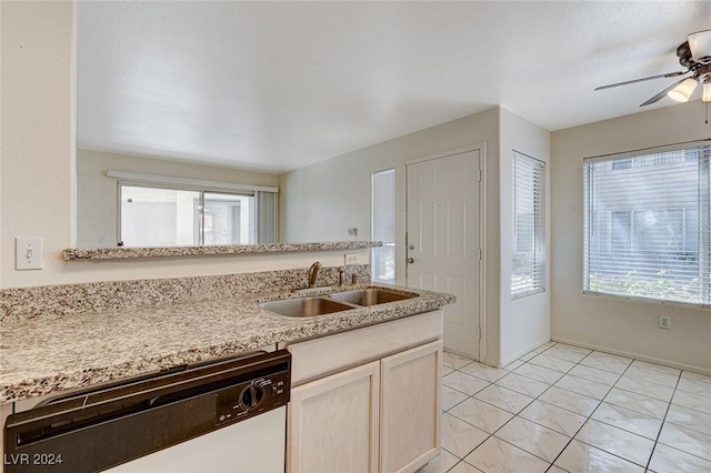 kitchen with sink, stainless steel dishwasher, ceiling fan, and light tile patterned floors