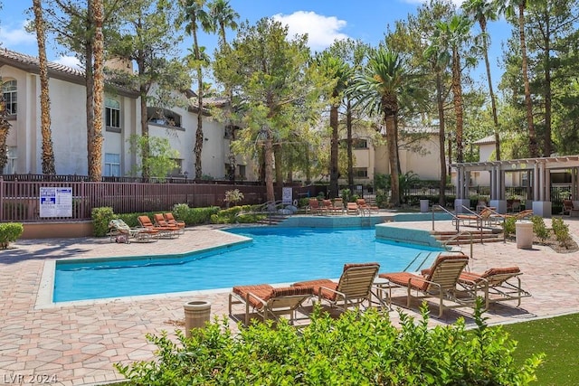 view of pool featuring a pergola and a patio