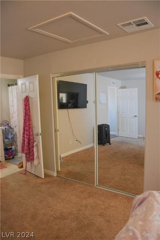 unfurnished bedroom with a closet and carpet