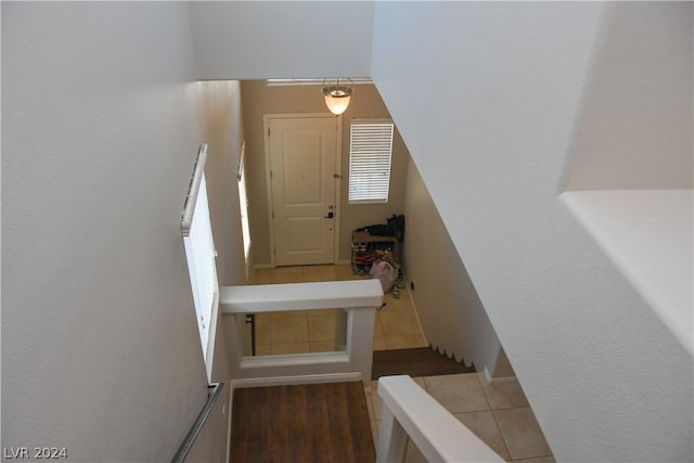 staircase featuring hardwood / wood-style flooring