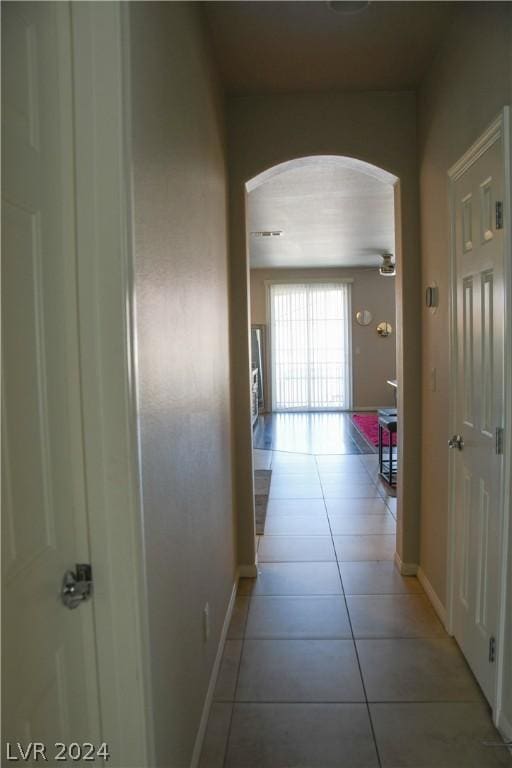 hallway featuring light tile patterned floors