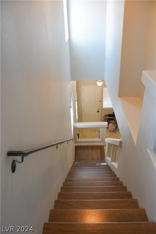 stairway with a towering ceiling