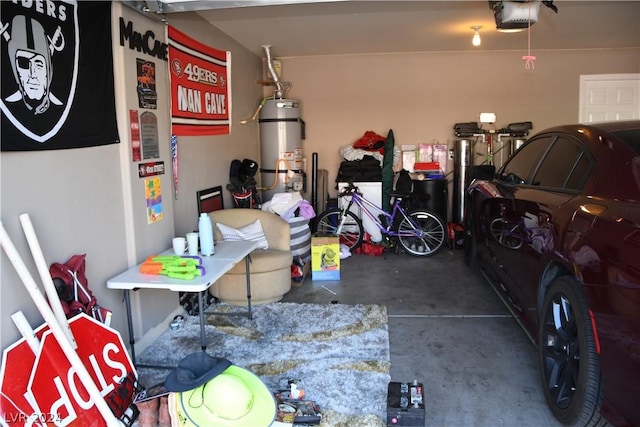 garage featuring a garage door opener and water heater