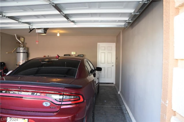 garage with a garage door opener and strapped water heater