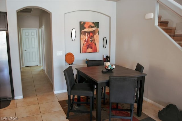 dining area featuring light tile patterned floors