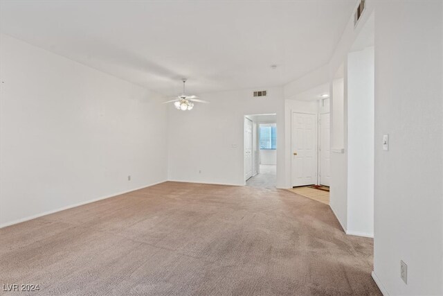 carpeted empty room with ceiling fan