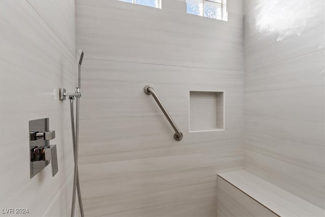 bathroom featuring tiled shower