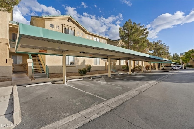 view of parking / parking lot with a carport