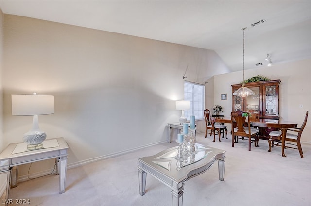 living room featuring light carpet and lofted ceiling