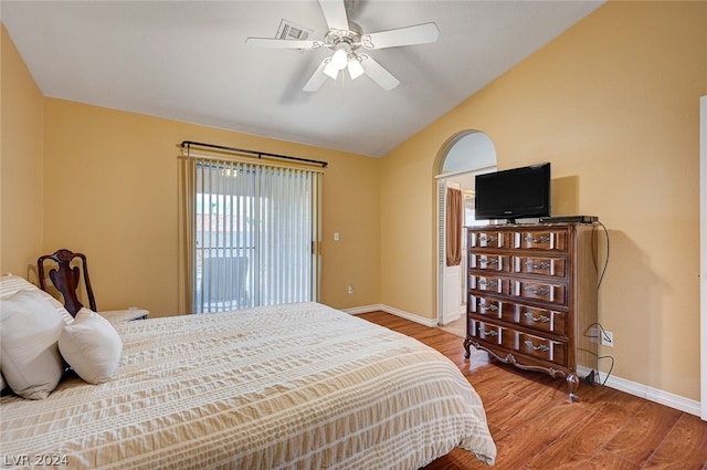 bedroom with wood-type flooring, lofted ceiling, and ceiling fan