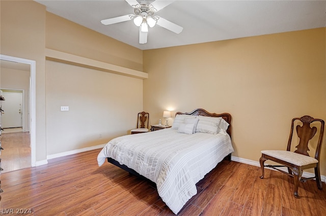 bedroom with ceiling fan and hardwood / wood-style floors