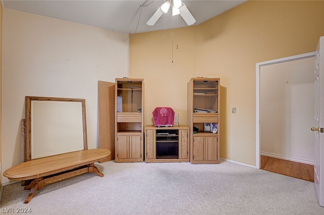 interior space featuring ceiling fan and carpet flooring