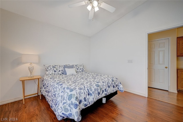 bedroom with lofted ceiling, hardwood / wood-style floors, and ceiling fan