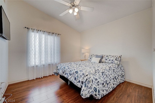 bedroom featuring hardwood / wood-style floors, ceiling fan, and vaulted ceiling