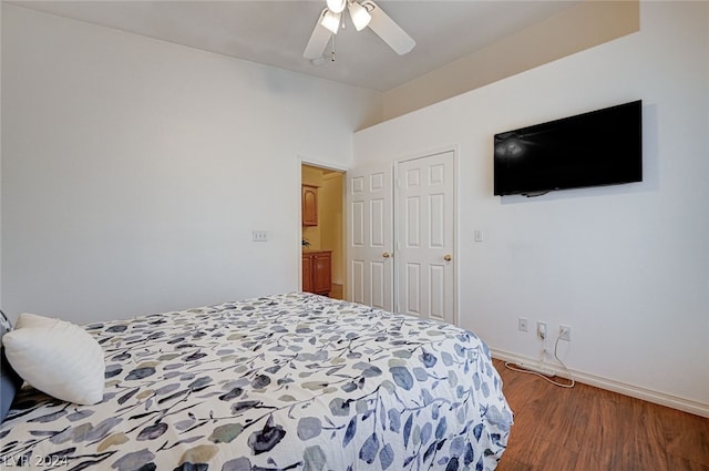 bedroom featuring a closet, wood-type flooring, and ceiling fan