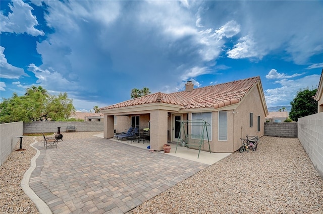 rear view of house featuring a patio