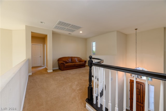 hallway with light carpet